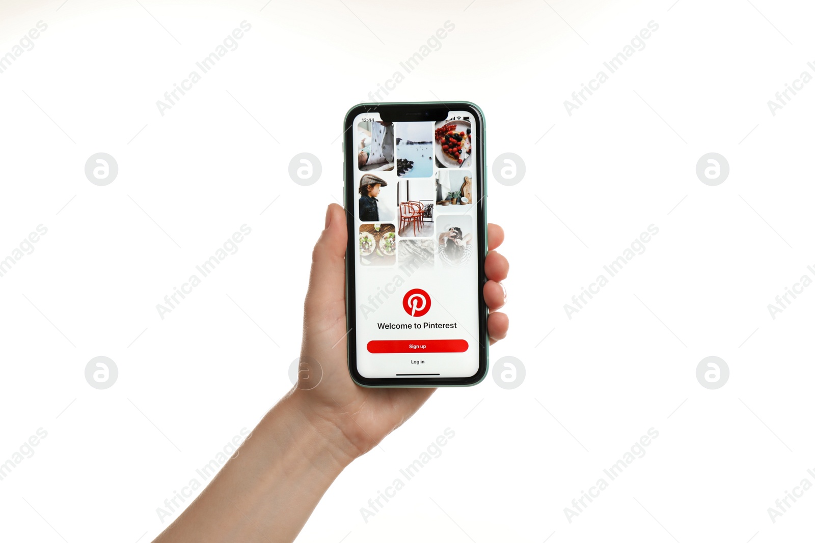 Photo of MYKOLAIV, UKRAINE - JULY 9, 2020: Woman holding  iPhone X with Pinterest app on white background, closeup