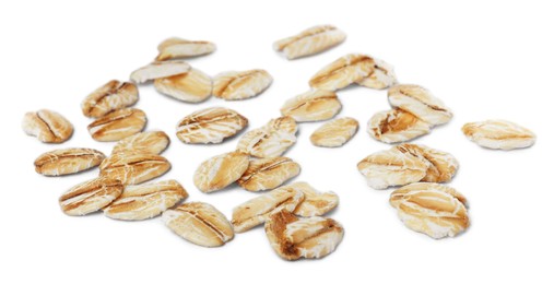 Photo of Scattered dry raw oatmeal on white background