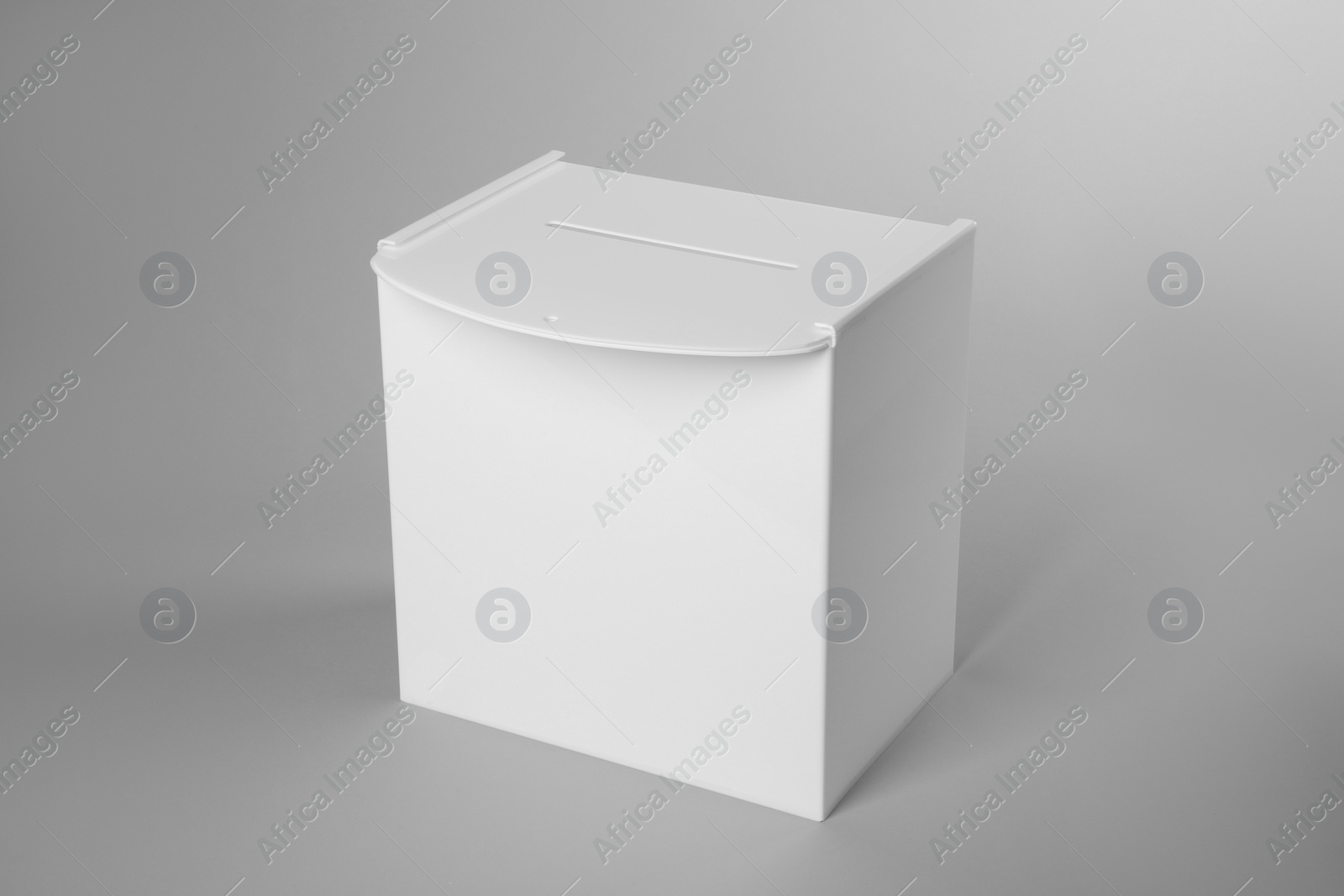 Photo of One ballot box on light grey background. Election time