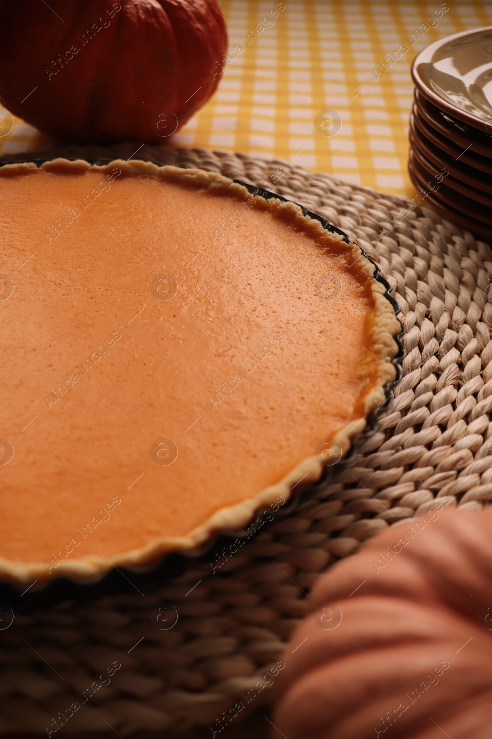 Photo of Delicious homemade pumpkin pie in baking dish on table