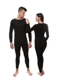 Couple wearing thermal underwear isolated on white