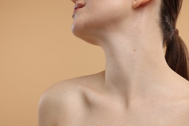 Beauty concept. Woman on beige background, closeup