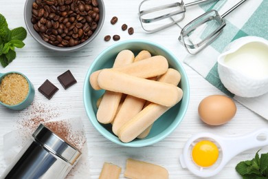 Flat lay composition with ingredients for tiramisu on white wooden table