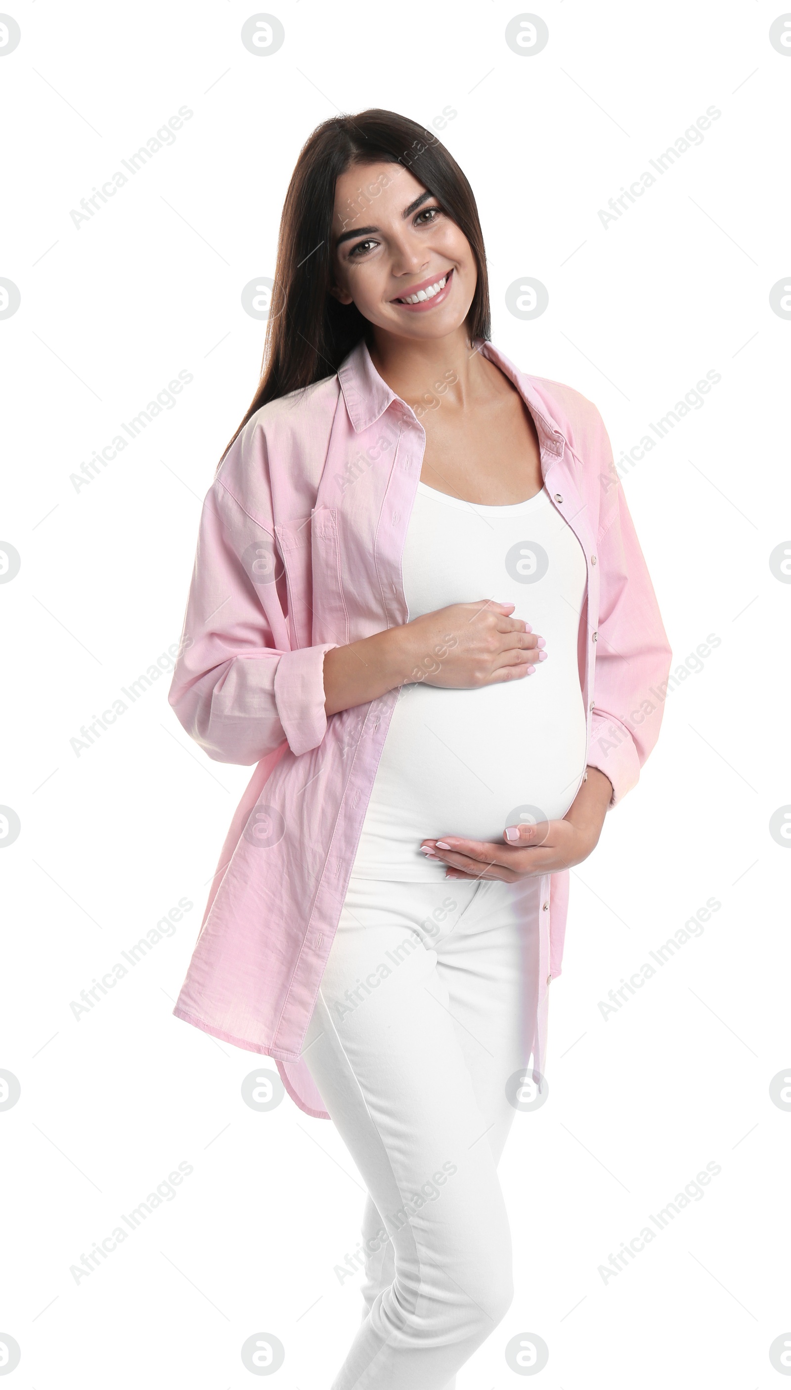 Photo of Happy pregnant woman holding her belly on white background