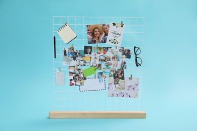 Photo of Vision board with different photos and other elements representing dreams on turquoise background