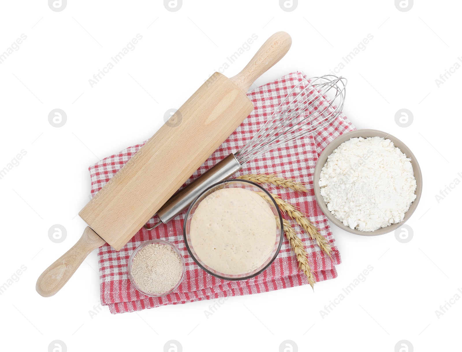 Photo of Leaven, flour, rolling pin, whisk and ears of wheat isolated on white, top view