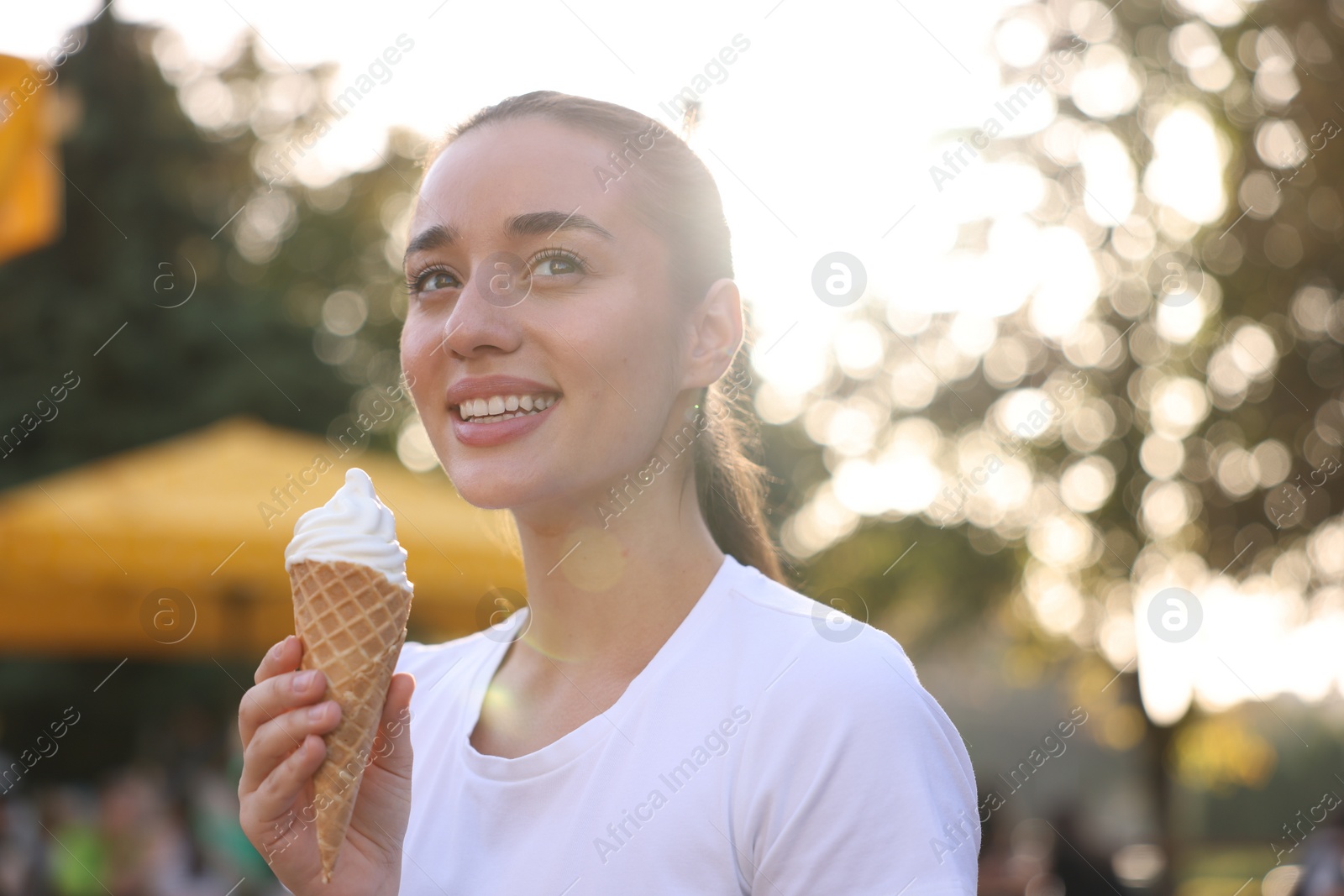 Photo of Lviv, Ukraine - September 26, 2023: Woman with McDonald's ice cream outdoors. Space for text