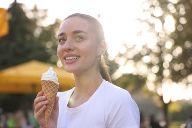 Photo of Lviv, Ukraine - September 26, 2023: Woman with McDonald's ice cream outdoors. Space for text