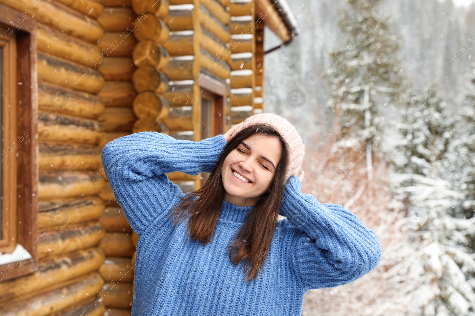 Photo of Pretty woman in warm sweater outdoors on winter day