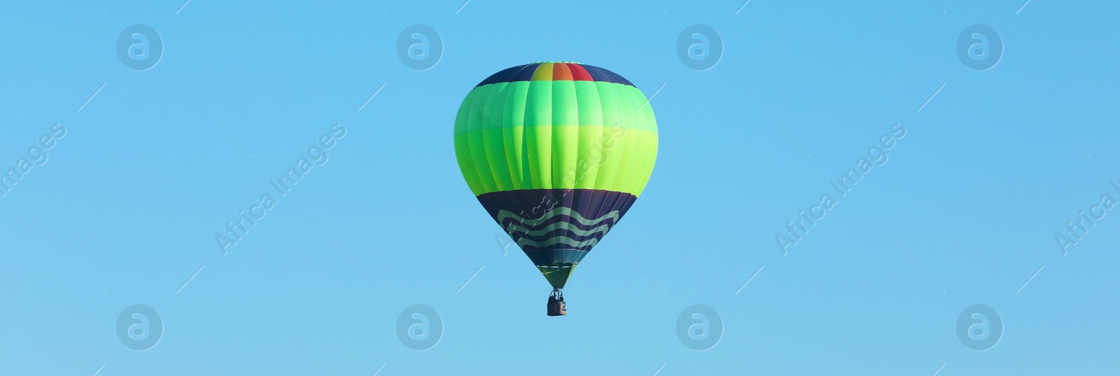 Image of Hot air balloon in blue sky. Banner design 