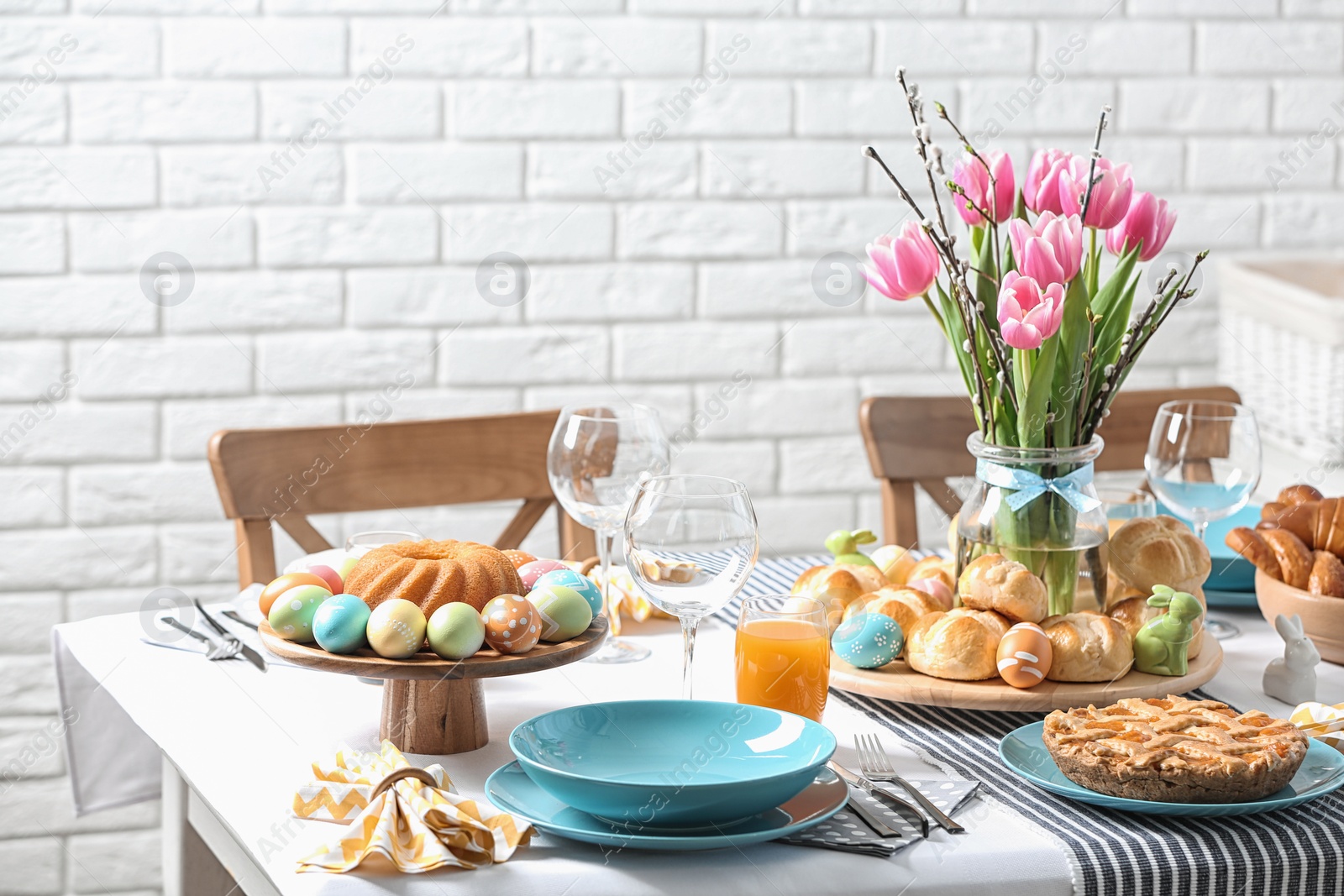 Photo of Festive Easter table setting with traditional meal at home