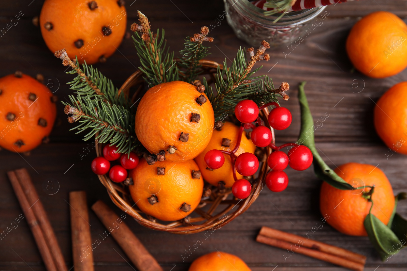 Photo of Flat lay composition with tangerine pomander balls on wooden table