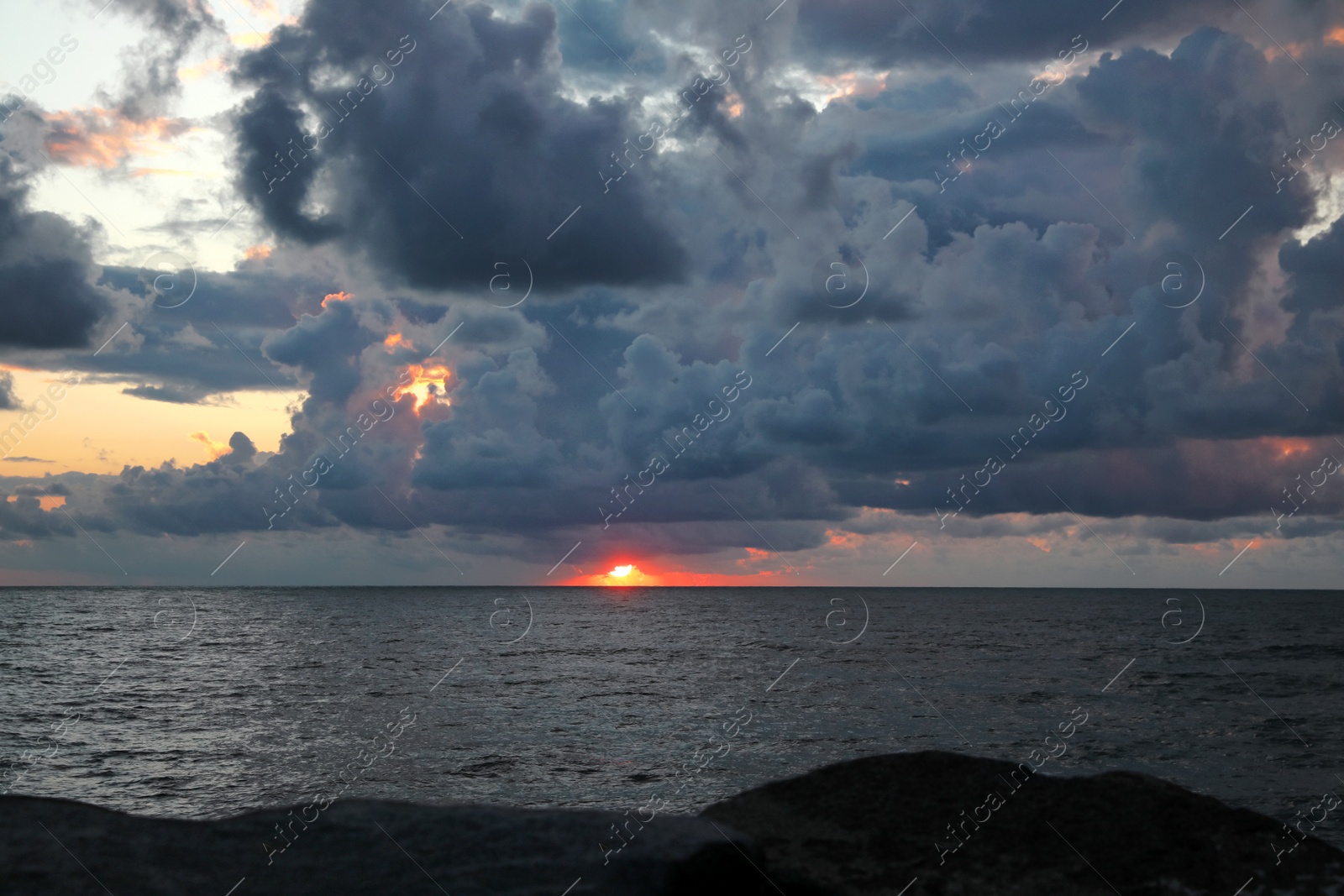 Photo of Picturesque view of sky with heavy rainy clouds over sea