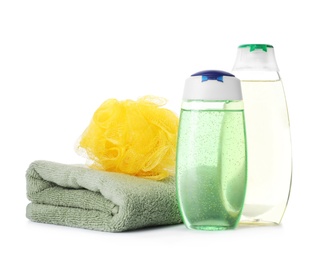Photo of Personal hygiene products, shower puff and towel on white background