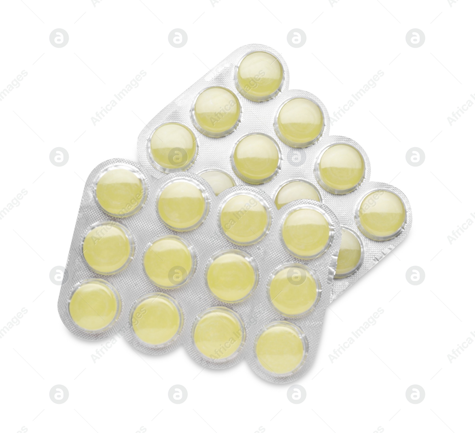 Photo of Blisters with yellow cough drops isolated on white, top view. Cold remedies