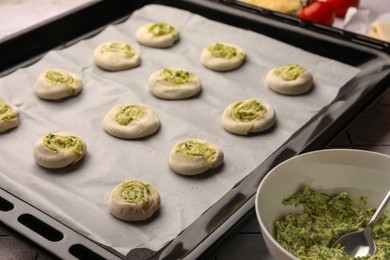 Baking sheet with raw puff pastry, closeup