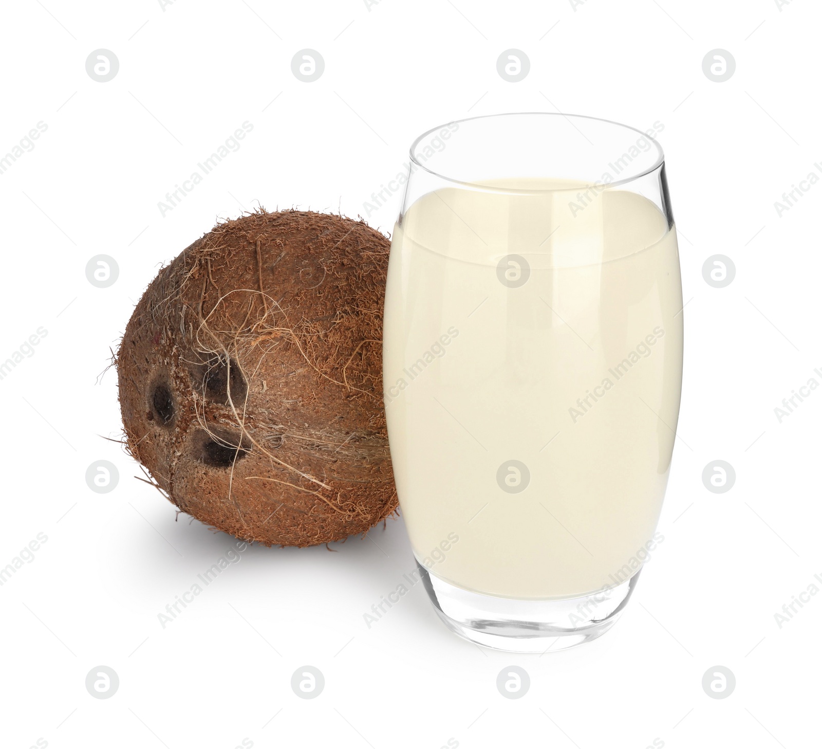 Photo of Glass of coconut water and nut isolated on white