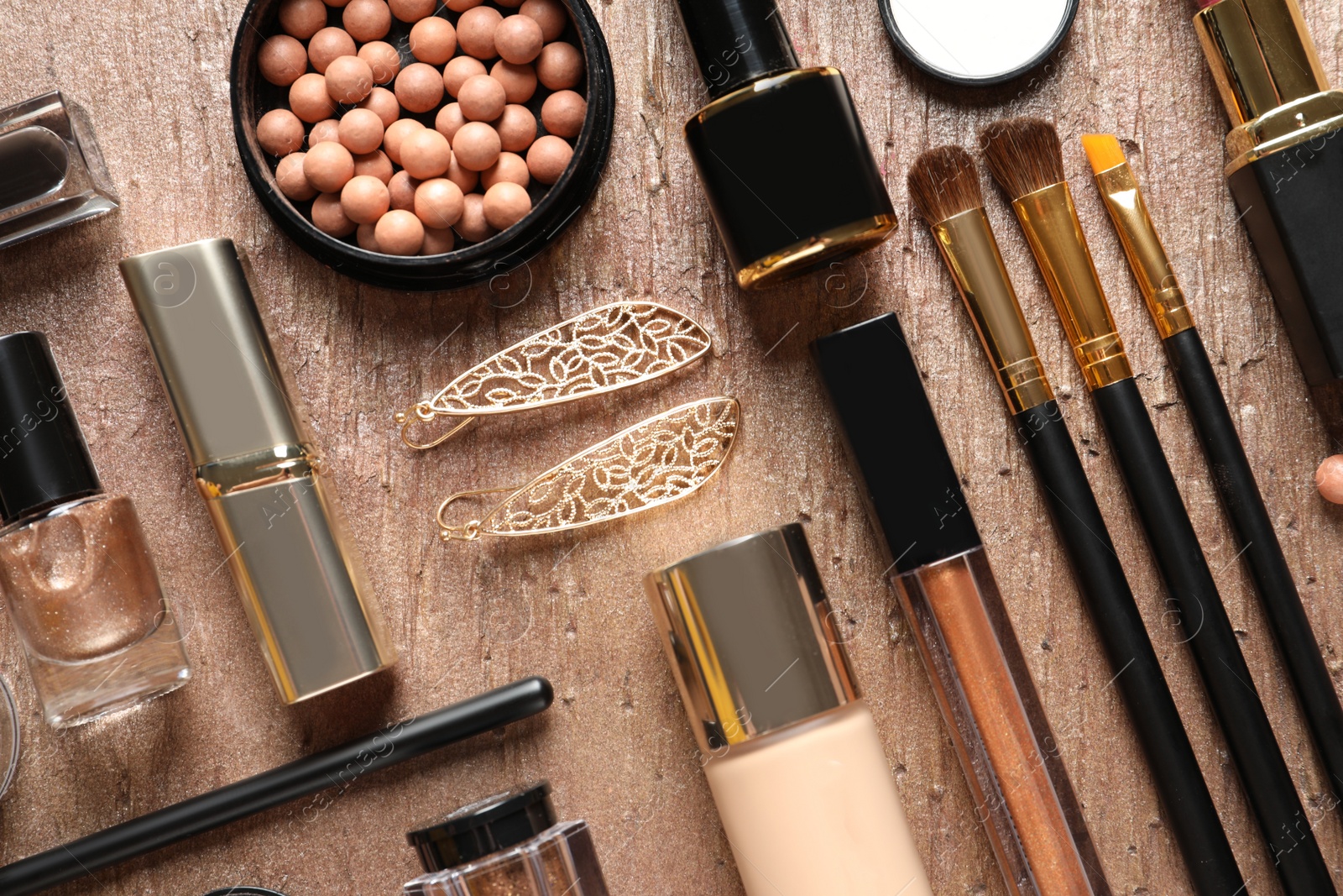 Photo of Set of luxury makeup products on color background, flat lay
