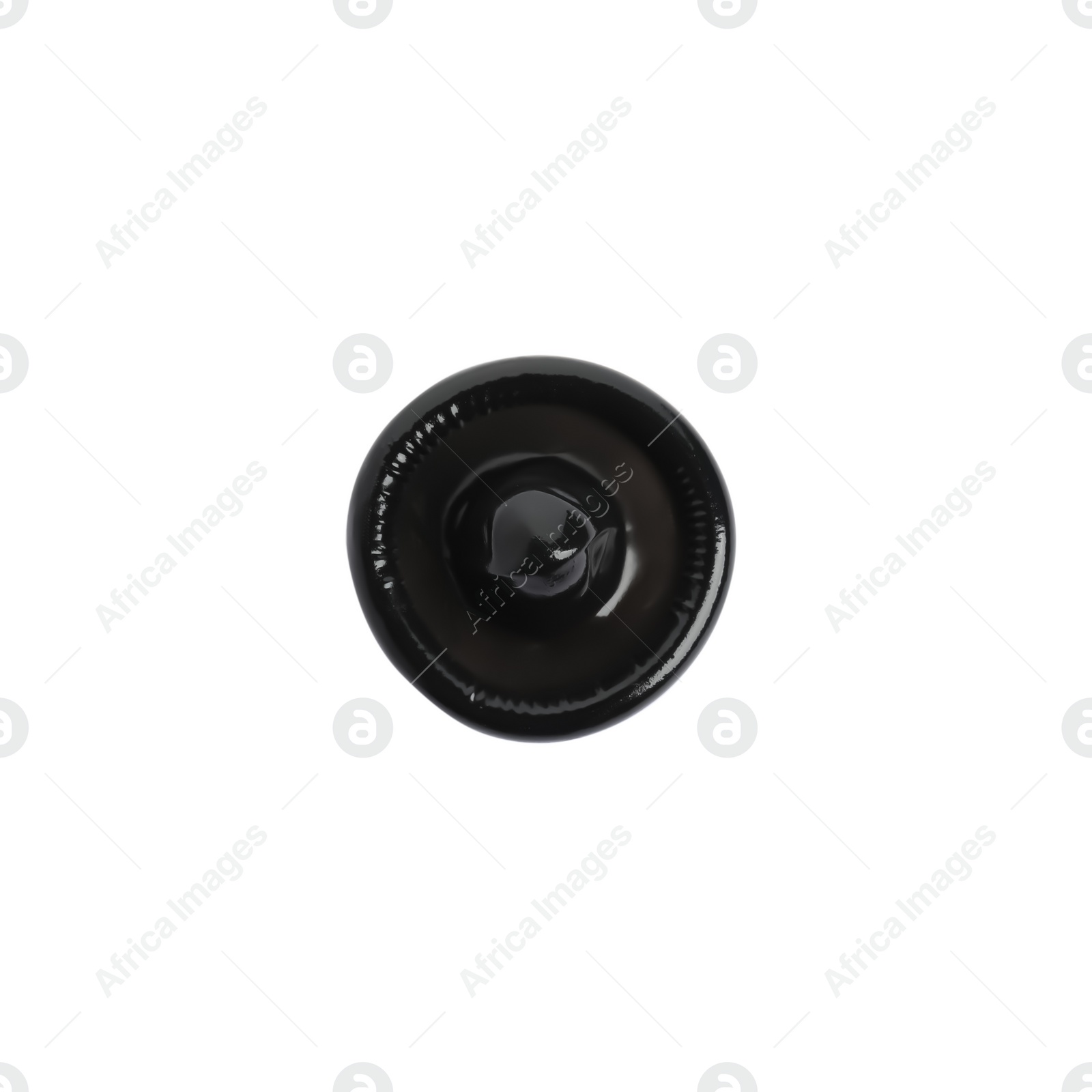 Photo of Unpacked black condom isolated on white, top view. Safe sex