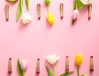 Photo of Flat lay composition with different lipsticks and tulip flowers on color background, space for text