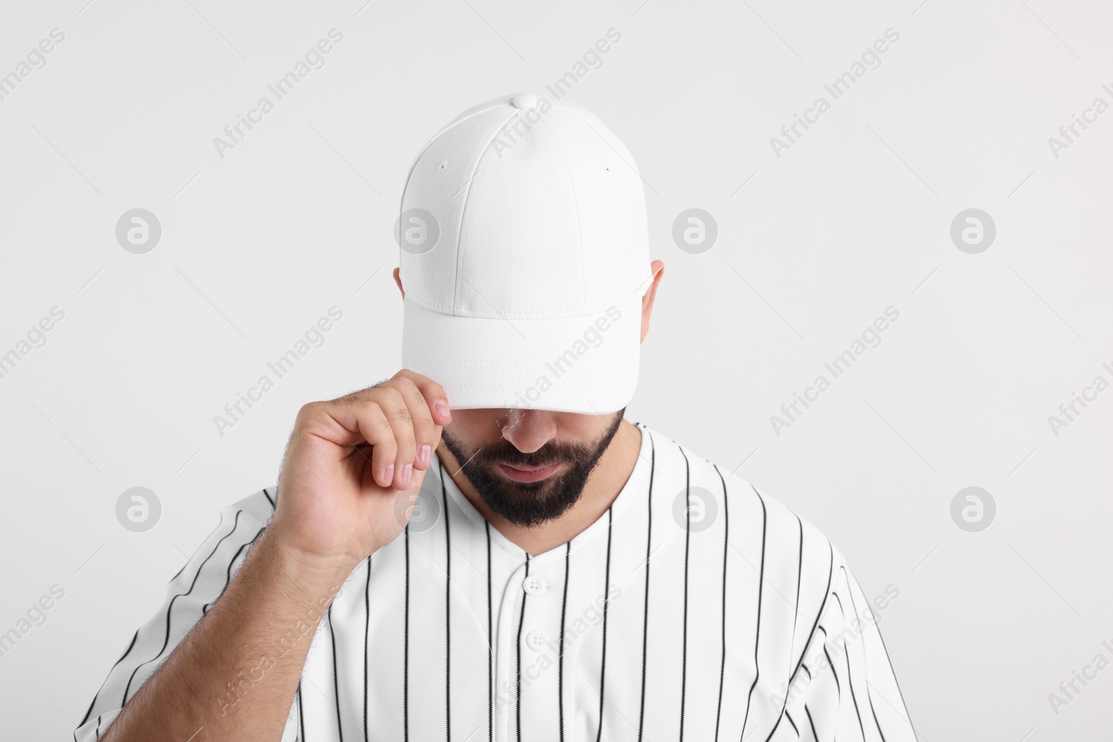 Photo of Man in stylish baseball cap on white background