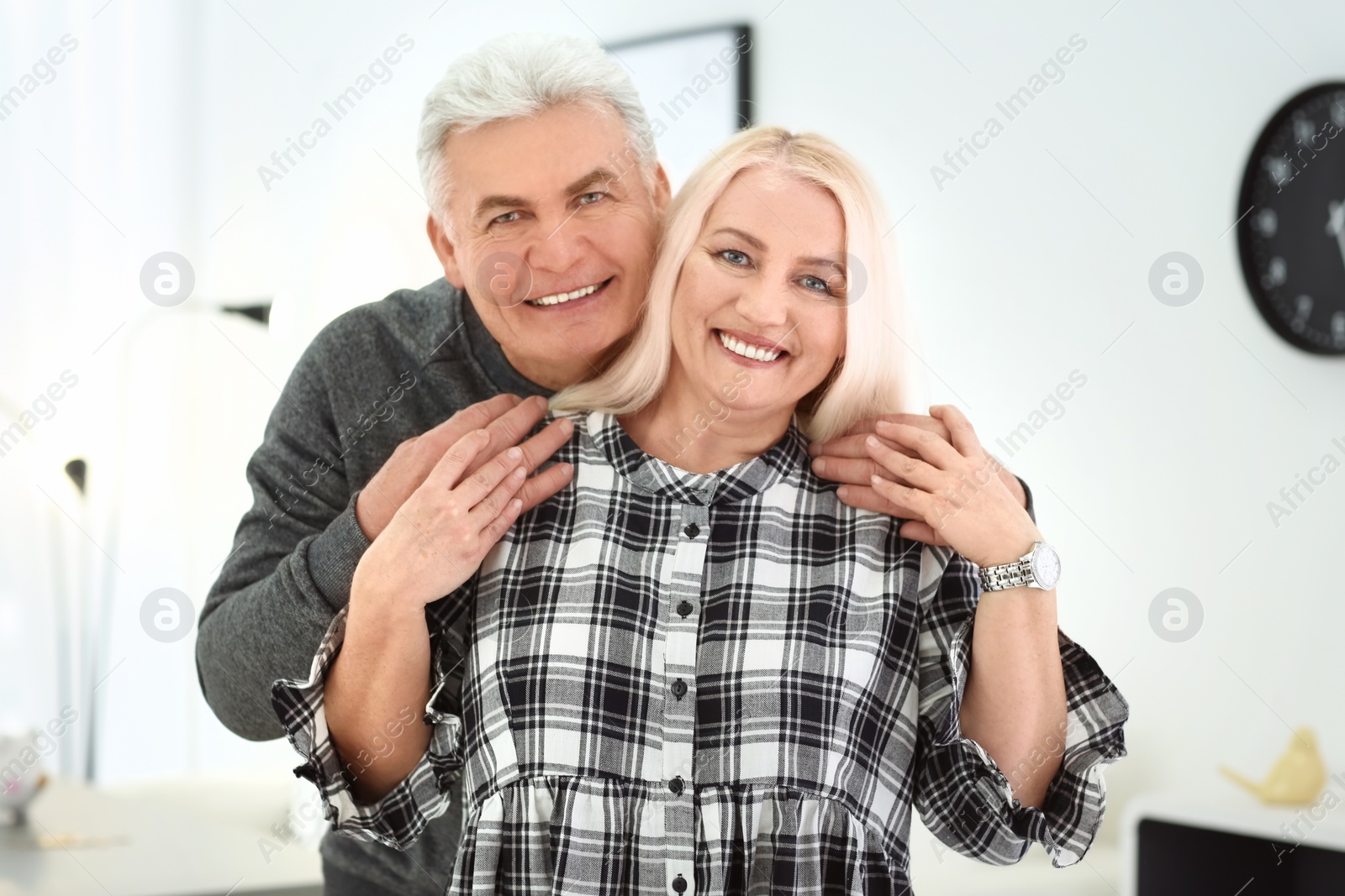 Photo of Portrait of adorable mature couple together indoors