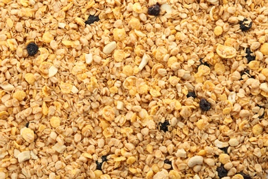 Photo of Muesli with raisins as background. Healthy grains and cereals