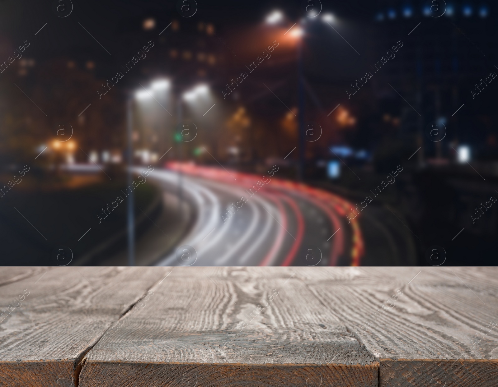 Image of Empty wooden surface and blurred view of night cityscape. Bokeh effect 