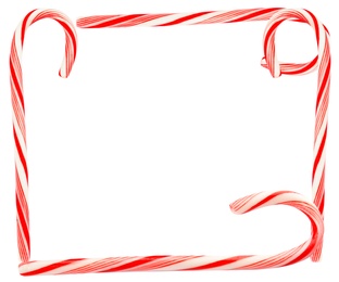 Image of Frame of tasty Christmas candy canes on white background