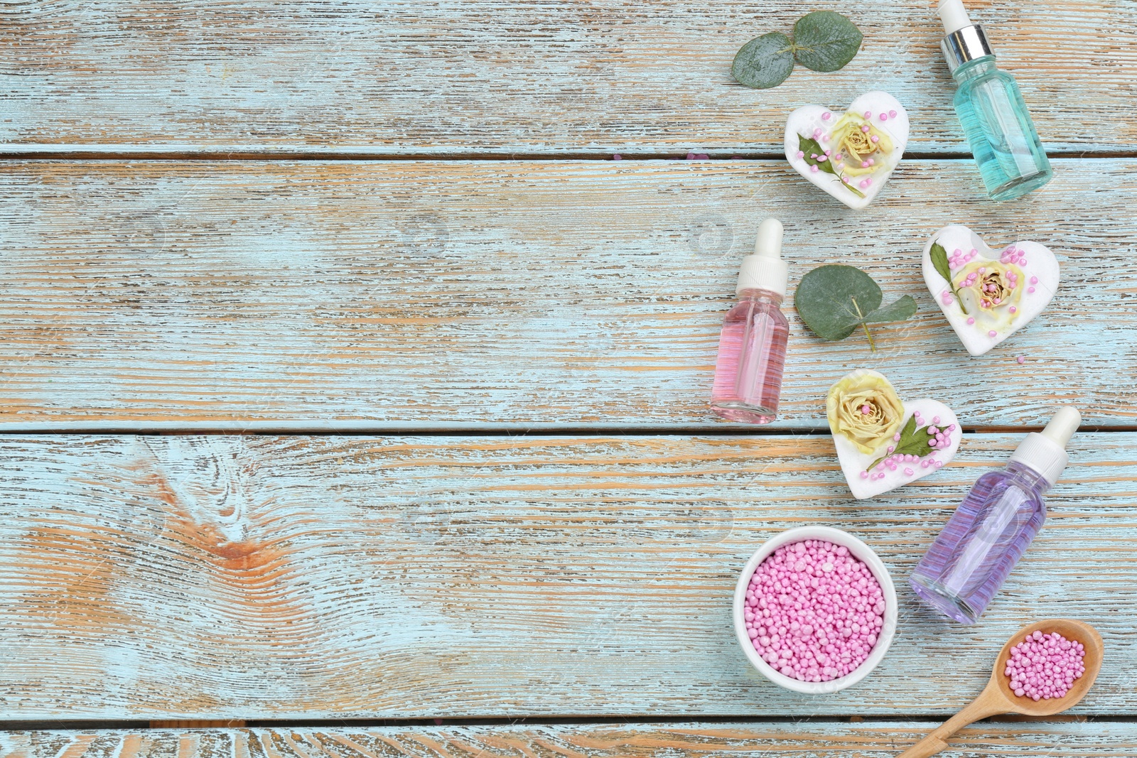 Photo of Flat lay composition with natural handmade soap on wooden background. Space for text