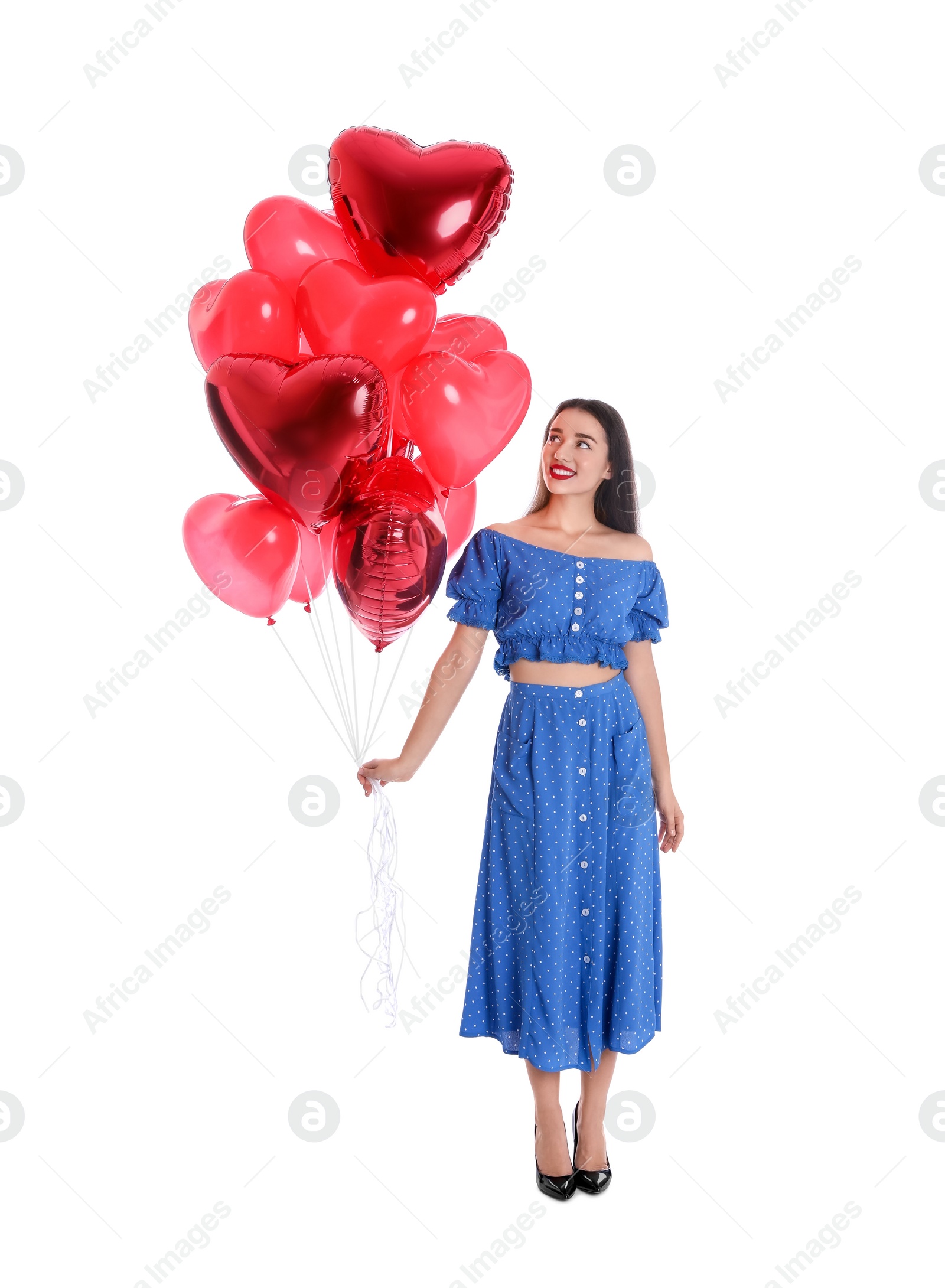 Photo of Beautiful young woman with heart shaped balloons isolated on white. Valentine's day celebration