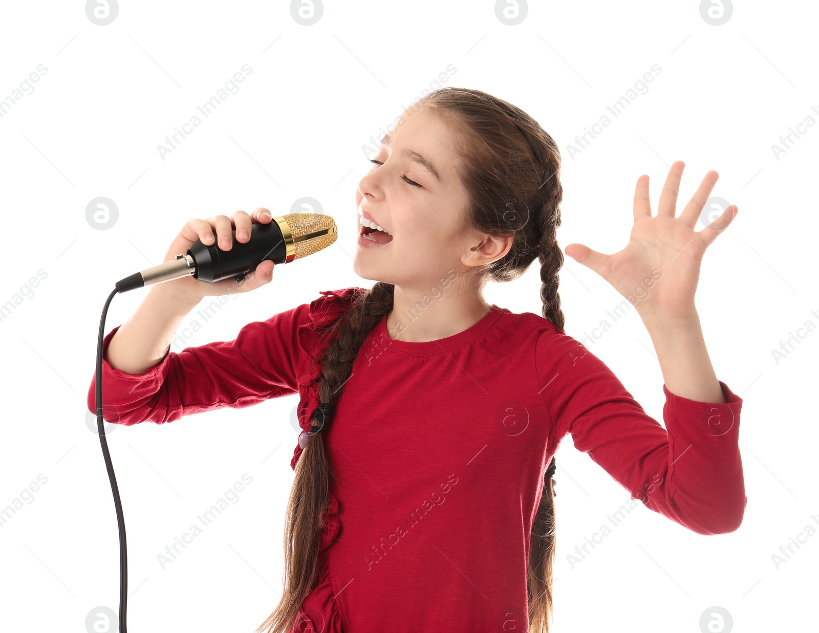 Photo of Cute girl singing in microphone on white background