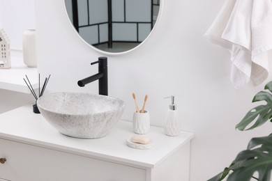 Photo of Different bath accessories and personal care products in bathroom