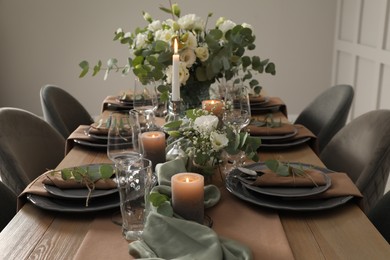 Festive table setting with beautiful floral decor indoors