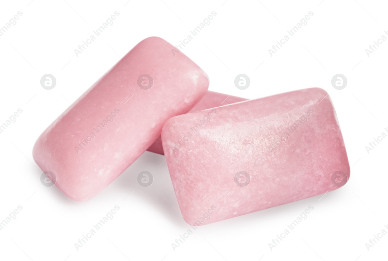 Photo of Tasty sweet chewing gums on white background