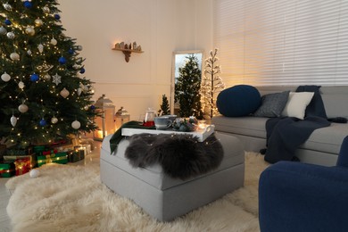 Photo of Cozy living room interior with beautiful Christmas tree and furniture