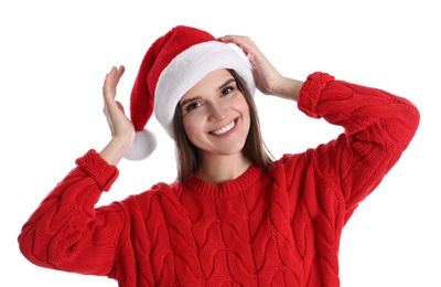 Pretty woman in Santa hat and red sweater on white background