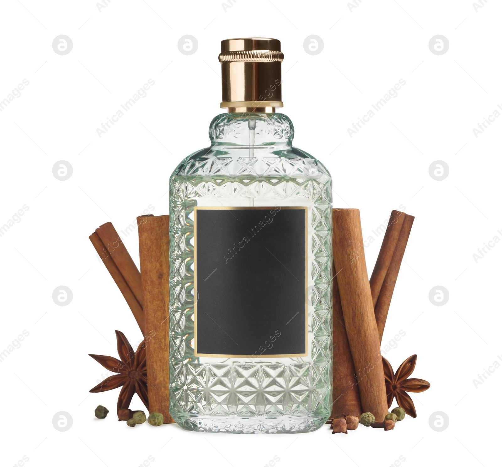 Photo of Bottle of perfume and different spices on white background