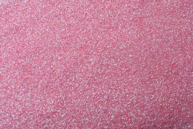 Photo of Beautiful shiny pink glitter as background, closeup