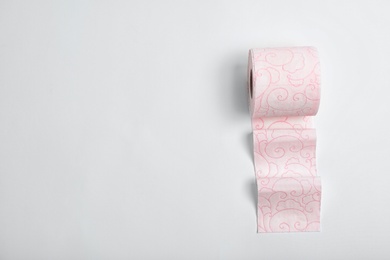 Photo of Roll of toilet paper on white background, top view. Space for text