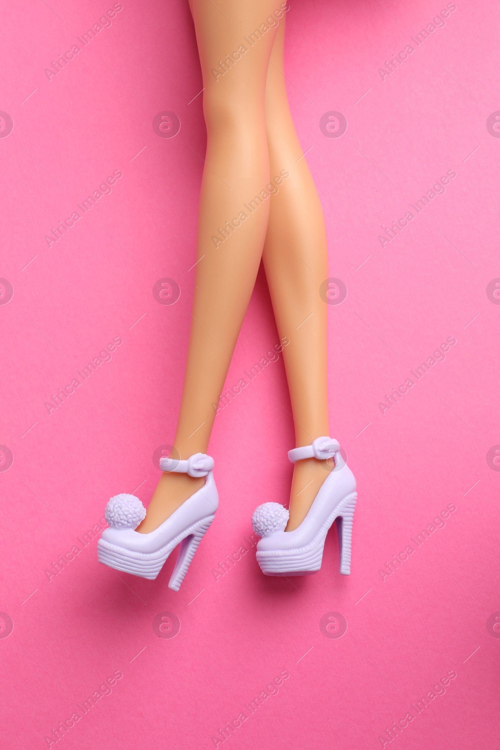 Photo of Mykolaiv, Ukraine - September 4, 2023: Barbie doll wearing beautiful heels on pink background, closeup