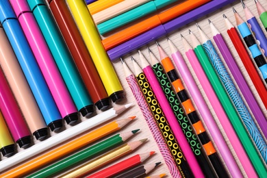 Different school stationery on wooden table, flat lay