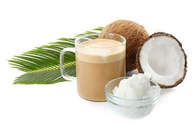 Photo of Delicious coffee with organic coconut oil and palm leaf isolated on white