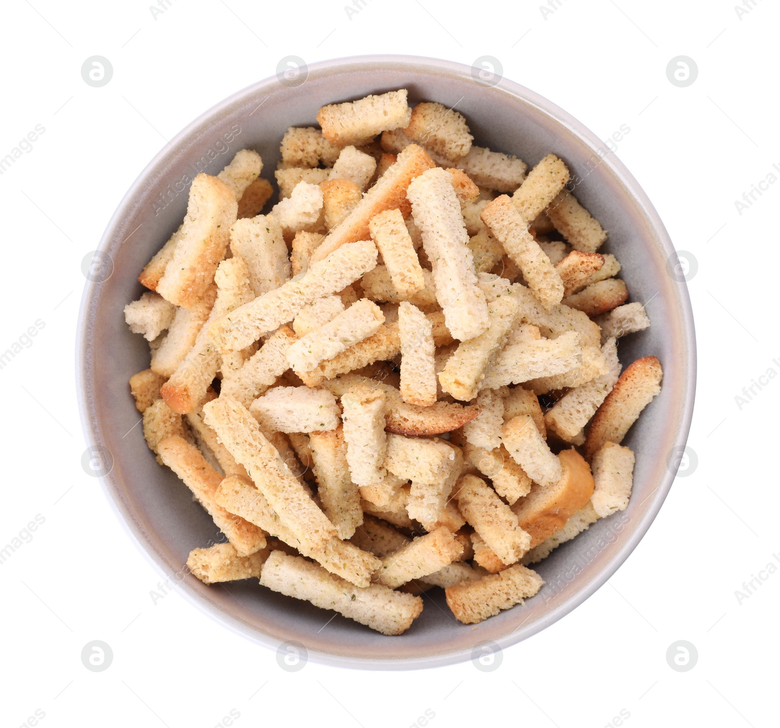 Photo of Crispy rusks with seasoning in bowl isolated on white, top view