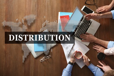 Image of Distribution. Business people working at table in office, top view. Illustration of world map