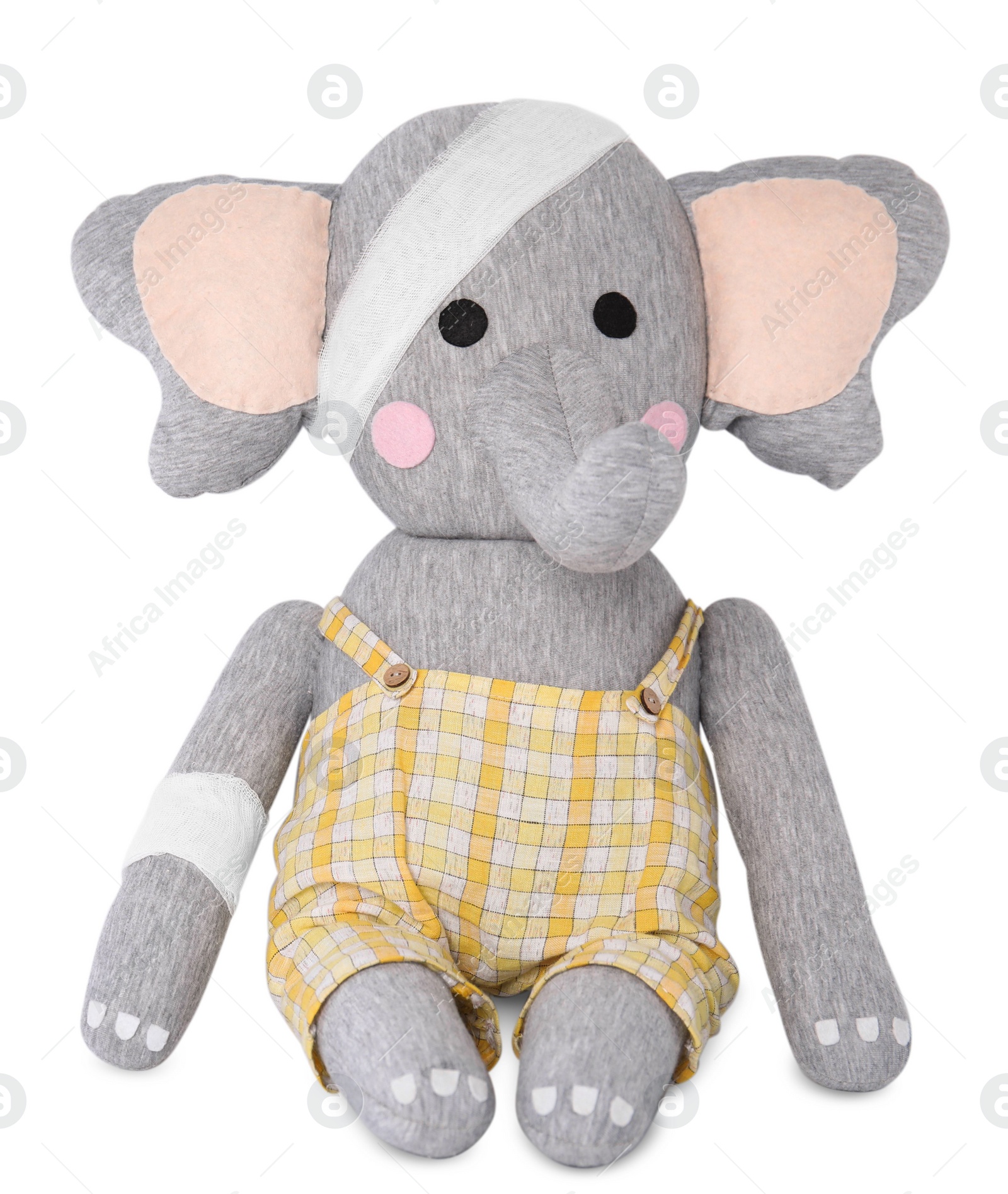 Photo of Toy elephant with bandages isolated on white