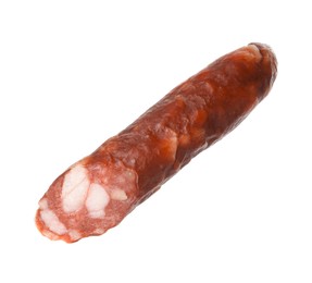 Piece of thin dry smoked sausage isolated on white