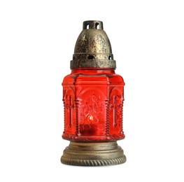 Photo of Red grave light with burning candle isolated on white. Symbol of remembrance