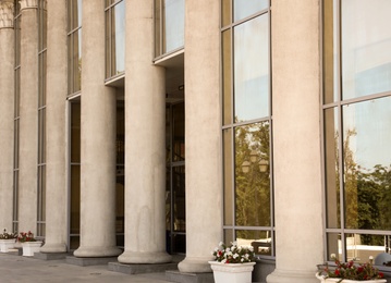Photo of Supreme court building with pillars. Law and justice