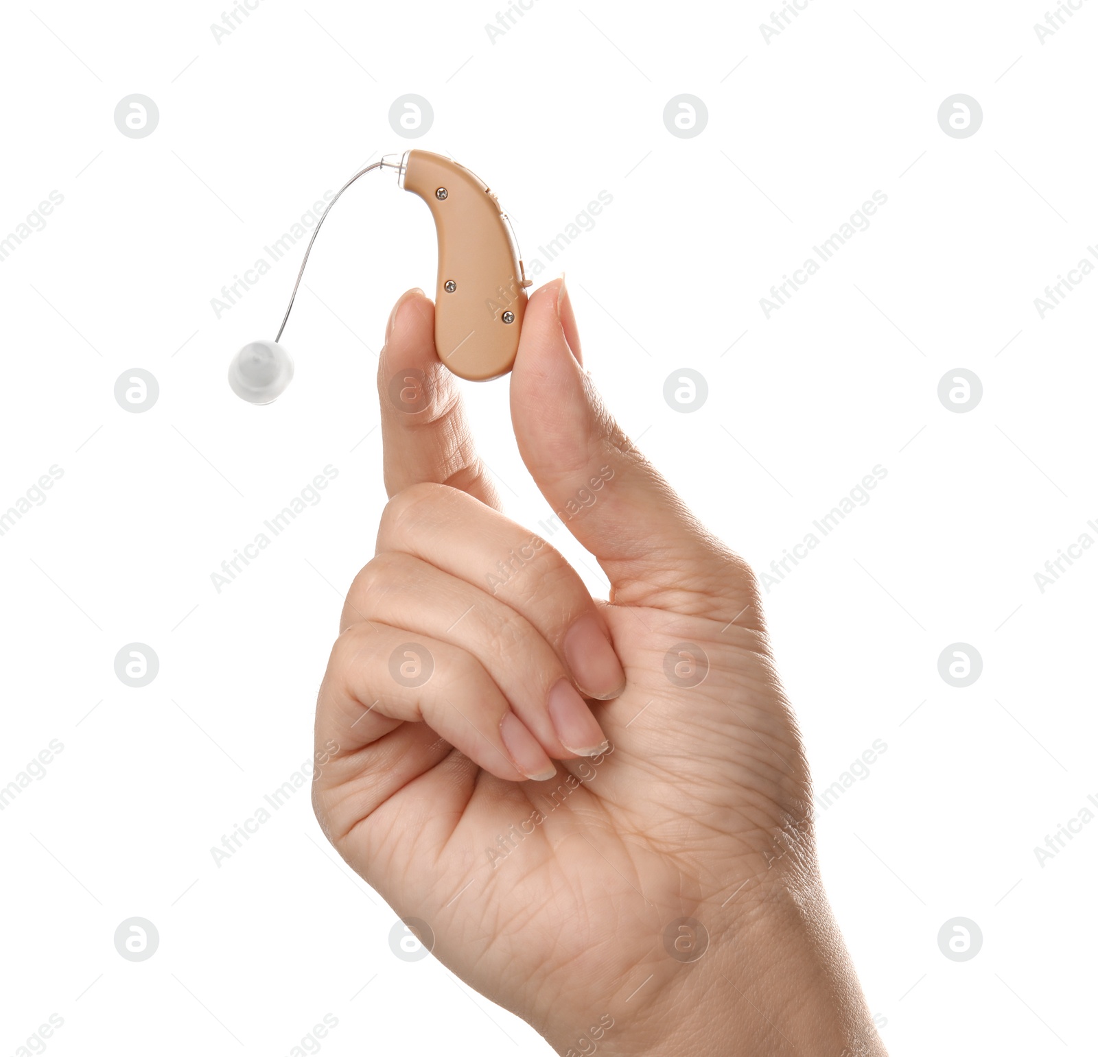 Photo of Woman holding hearing aid on white background, closeup